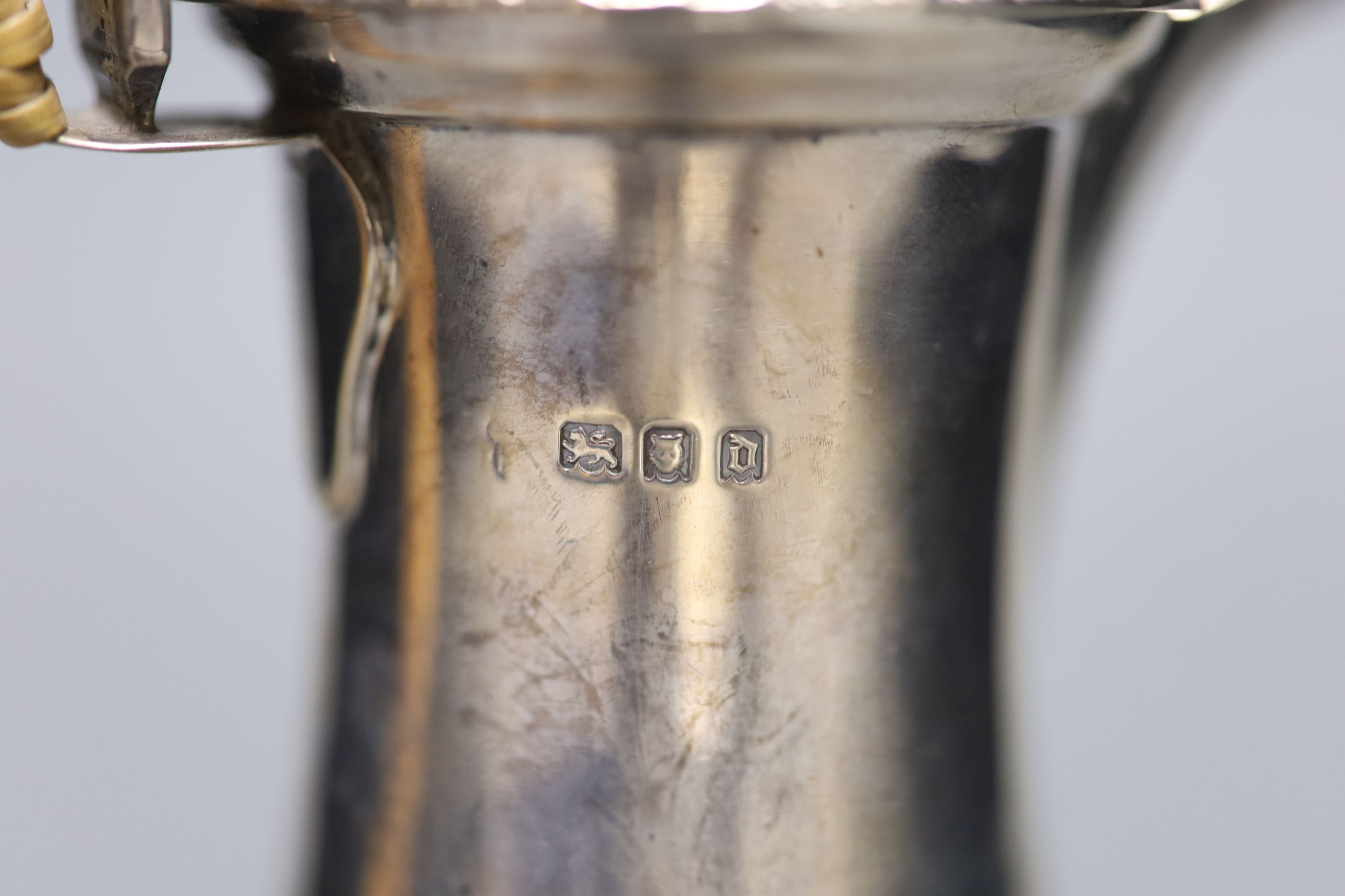 A George V silver hot water pot with rattan handle, London, 1919